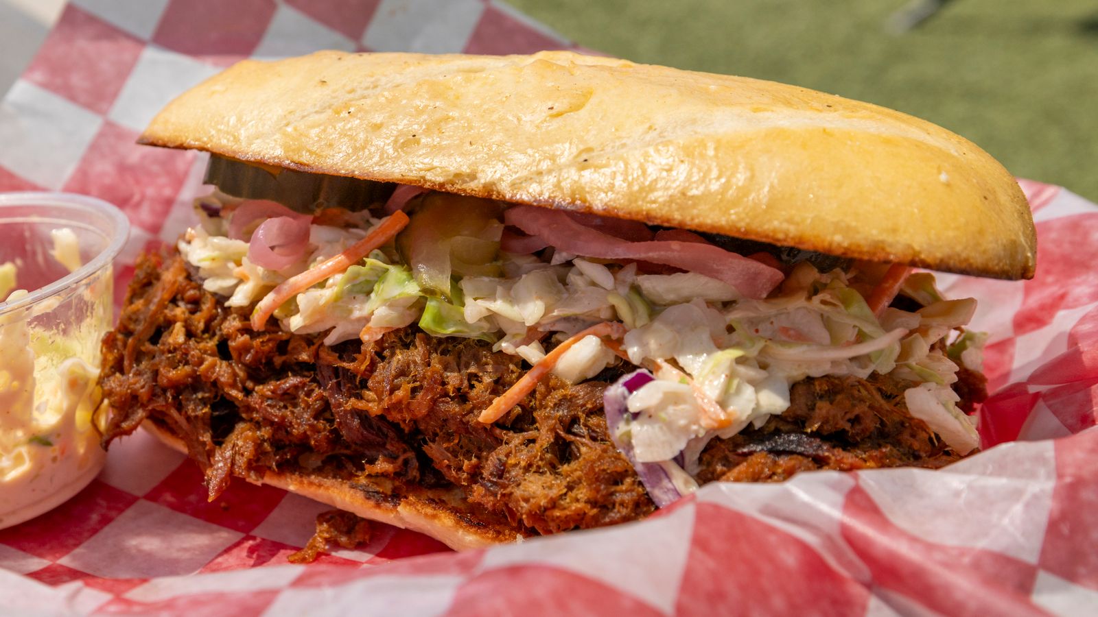 A chopped pork sandwich with cole slaw piled on the meat, Memphis style