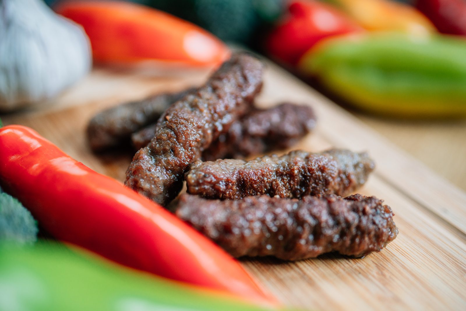 Small minced-meat sausages grilling